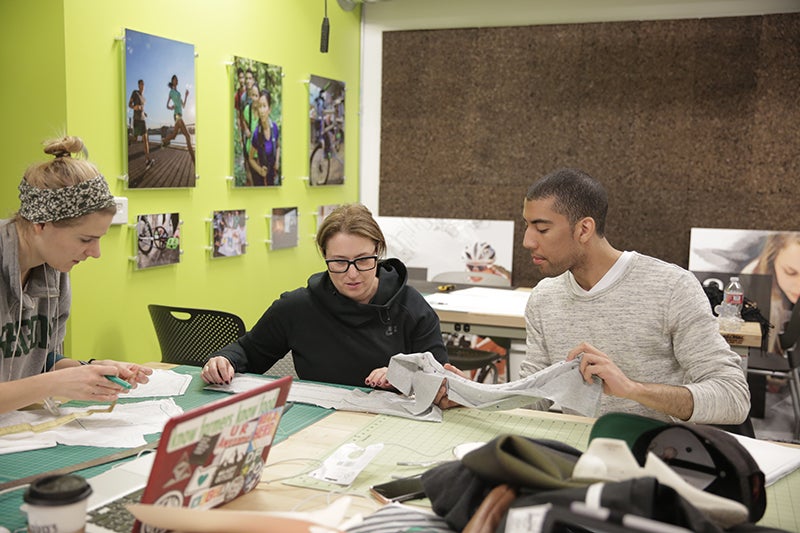 From left, Brittany Lang (BS ’16, product design), Associate Professor Susan Sokolowski, and product design student Austin Christianson discuss materials for a design.