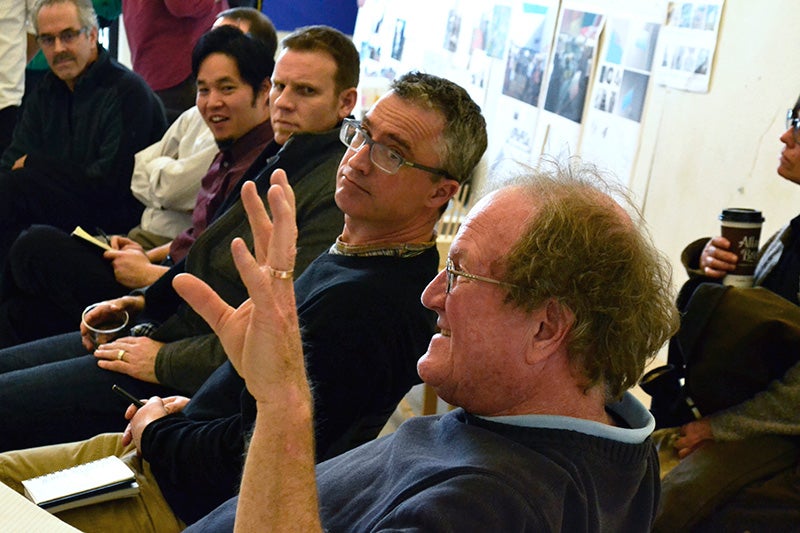 Brook Muller (second from right), associate dean for Academic Affairs in A&AA, and other reviewers listen as architecture Professor Don Corner (right) provides feedback. Photograph by Marti Gerdes.