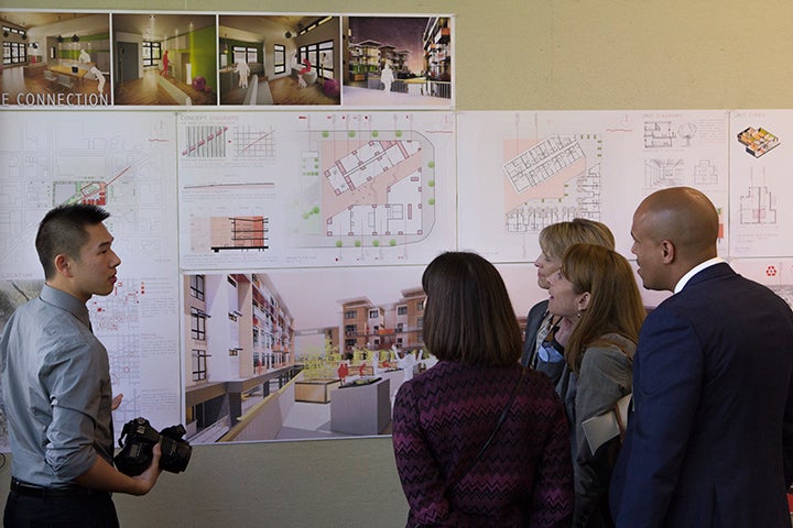 Curious and engaged UO Trustee board members listen to Kevin Loo-Chan describing his final architectural design project