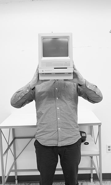 person holding computer