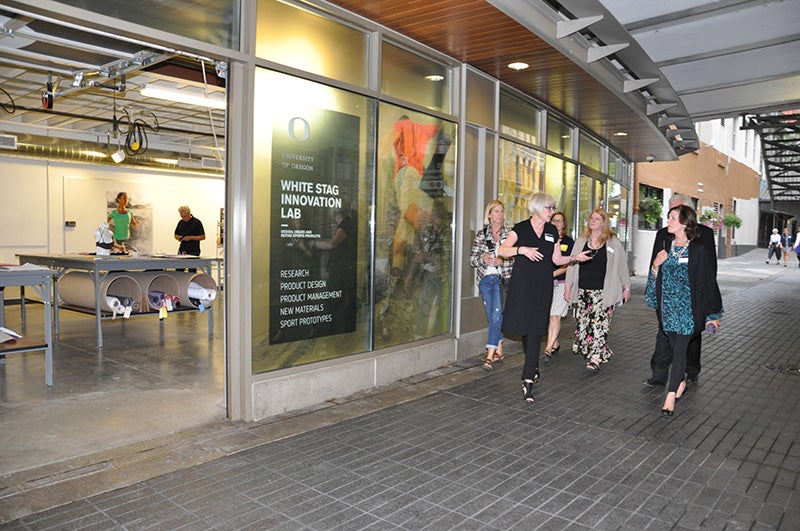 Kate Wagle, professor of Art, leads a group touring the White Stag Innovation Lab