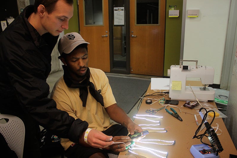 students work with LED light strips