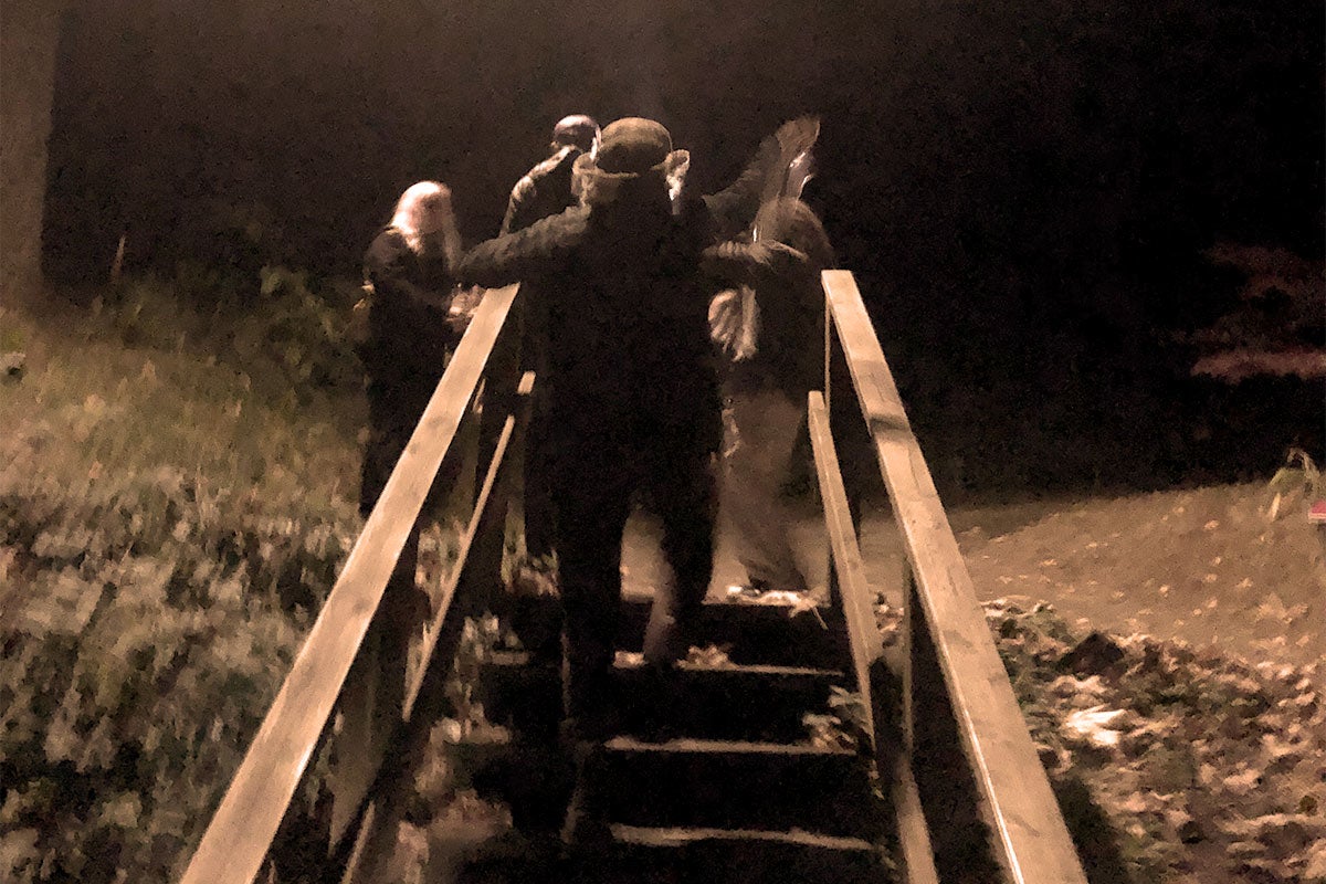 Photo of staircase with people at night