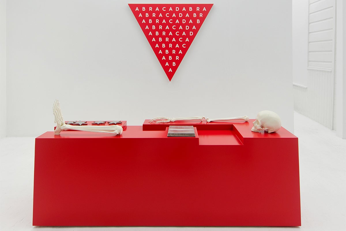 red desk and pennant artwork by Donald Morgan