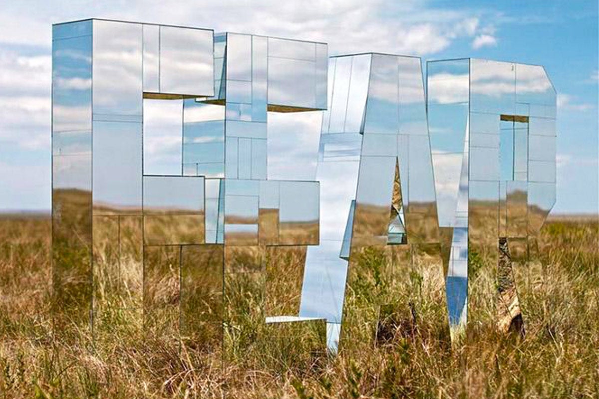 photo of mirror sculpture in field
