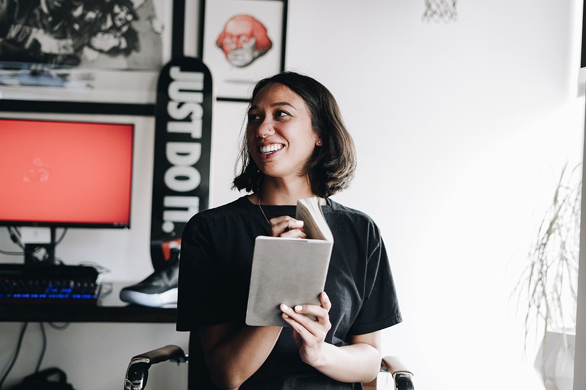 Portrait of alumna Mary Vertulfo at in an office