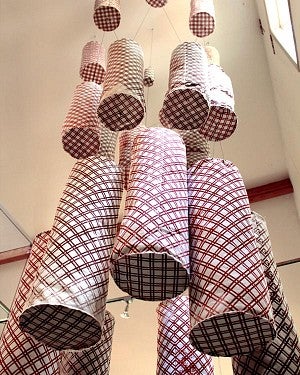 fabric cylinders hang from ceiling