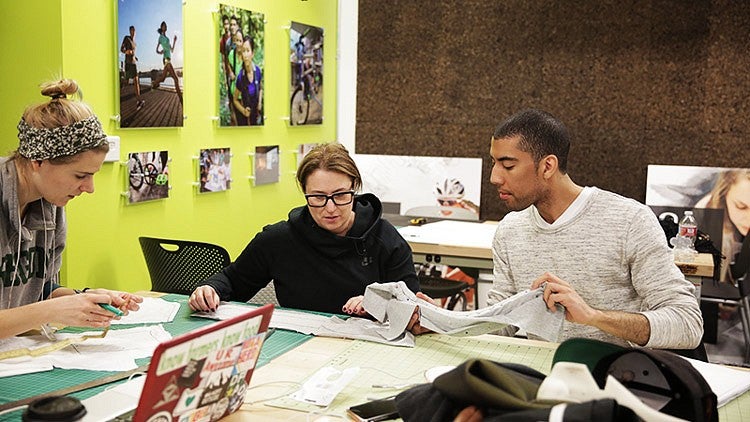 three students work on project