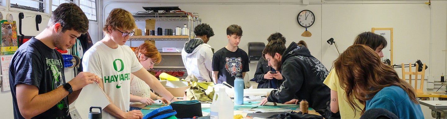 Photograph of A+D students in a studio. 