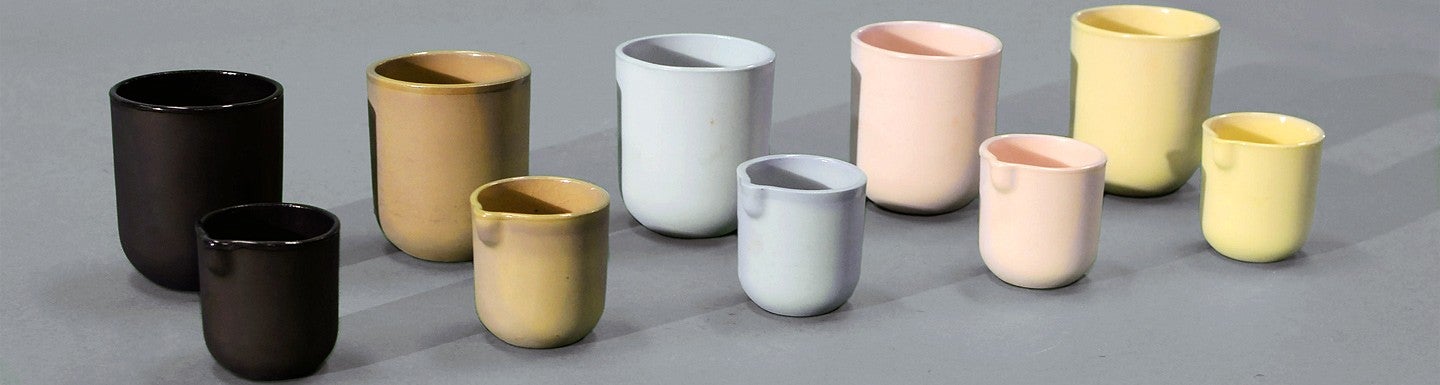 ceramic cups and matching creamers