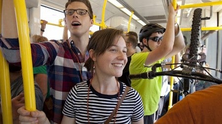students ride on TriMet light rail