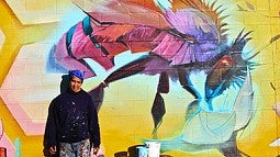 artist Steve Lopez with Mural
