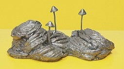 Silver mushroom on yellow artwork by Donald Morgan