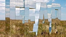 Photo of mirror sculpture in field