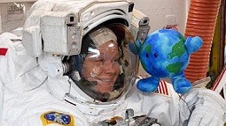 astronaut anne mcclain with earth toy