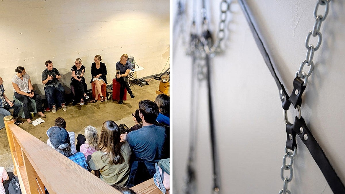an audience listening to a panel; leather and metal artwork in gallery