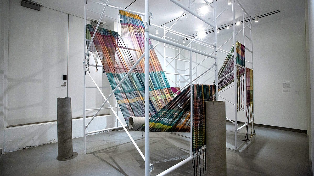 photos of fiber art weaving in gallery