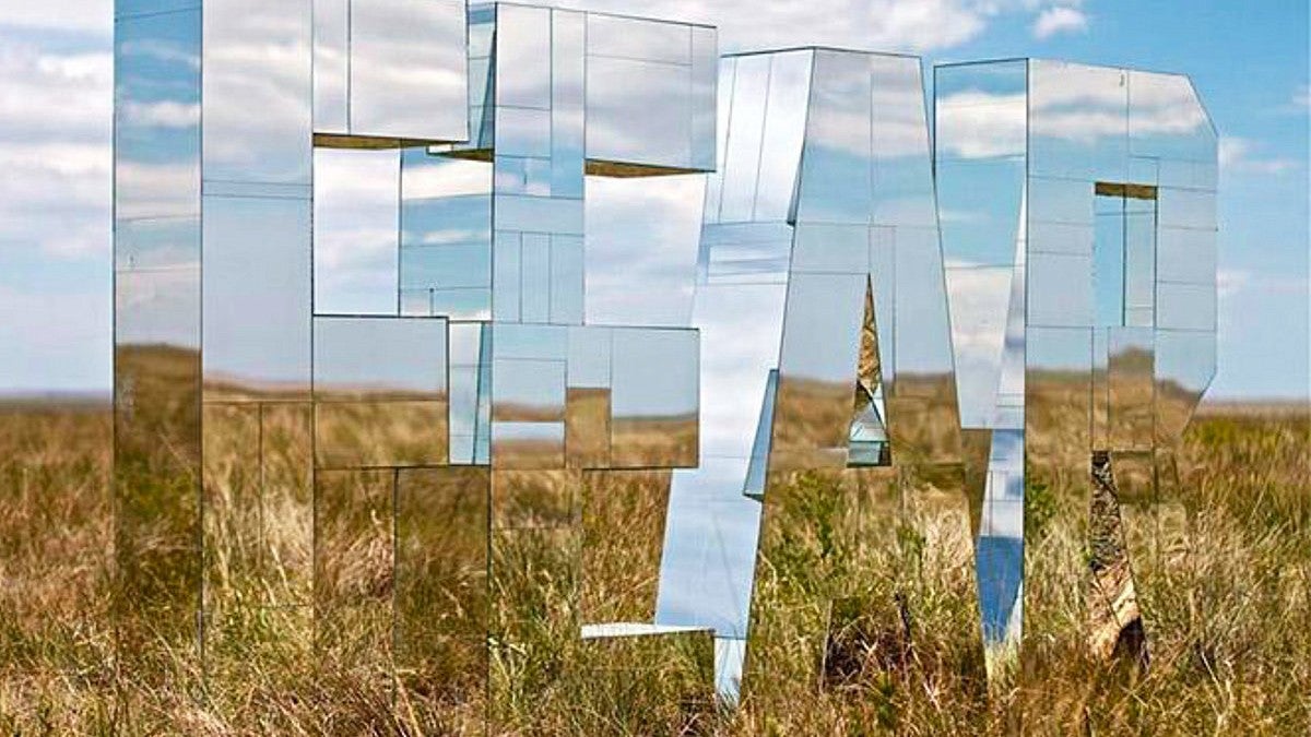 photo of mirror sculpture in field