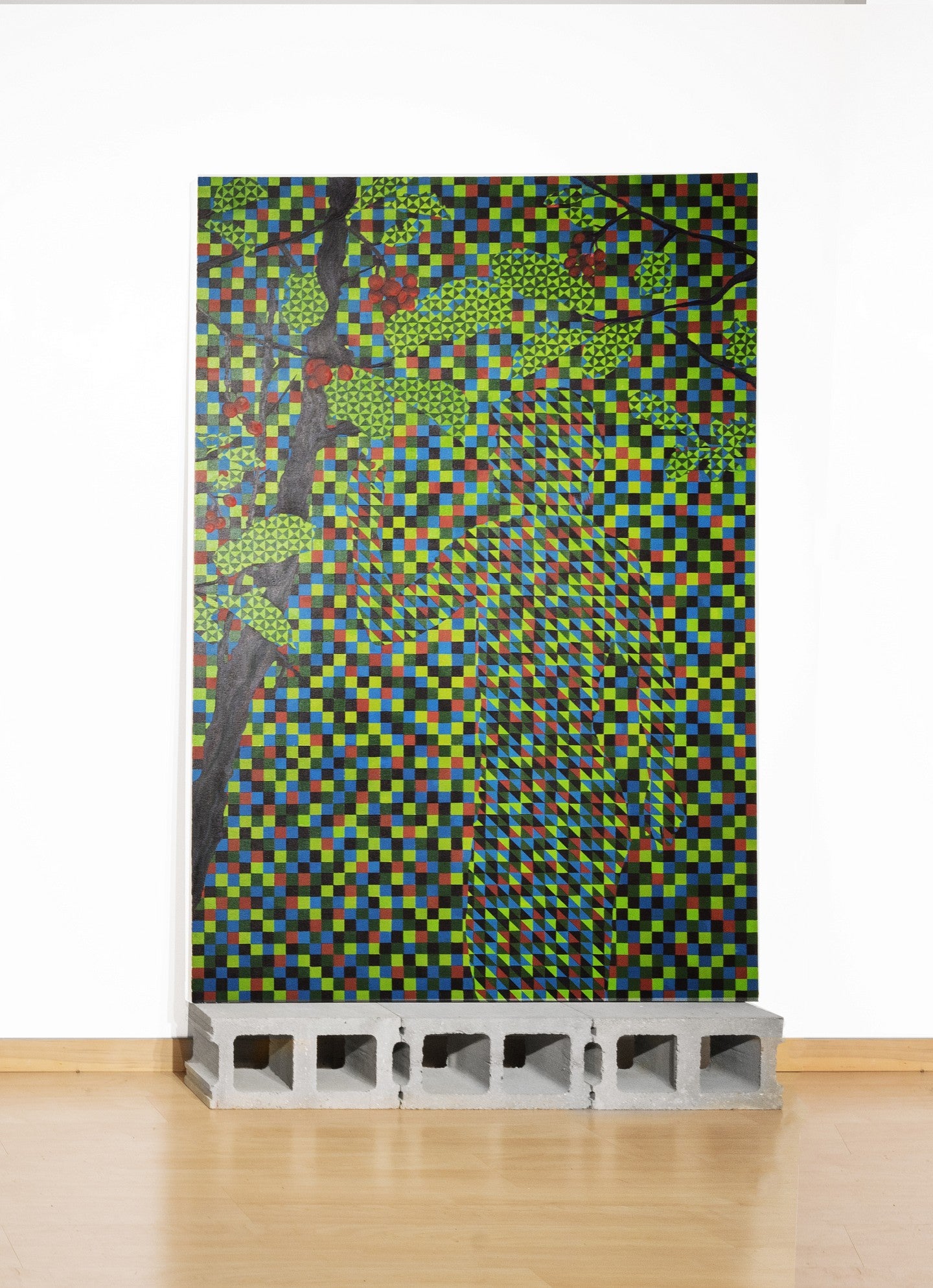 Photograph of a large abstract art piece that feature multicolored squares. 