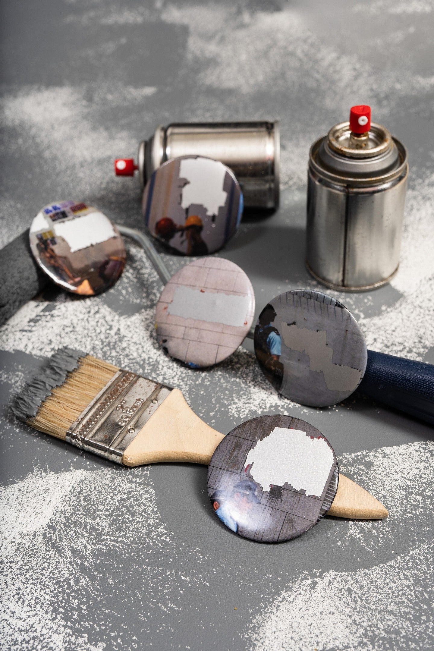 Photograph of empty spray paint cans. 