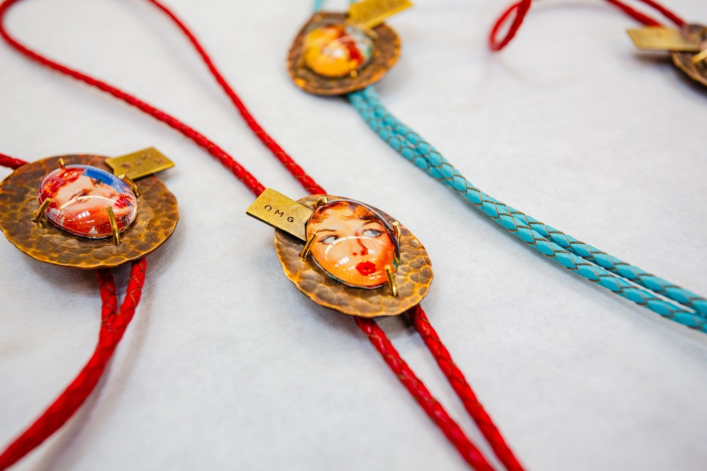 Photograph of three necklaces.