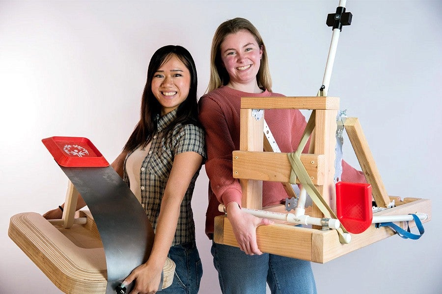 News header for Product Design Story. Shows two students with their catapult prototypes. 