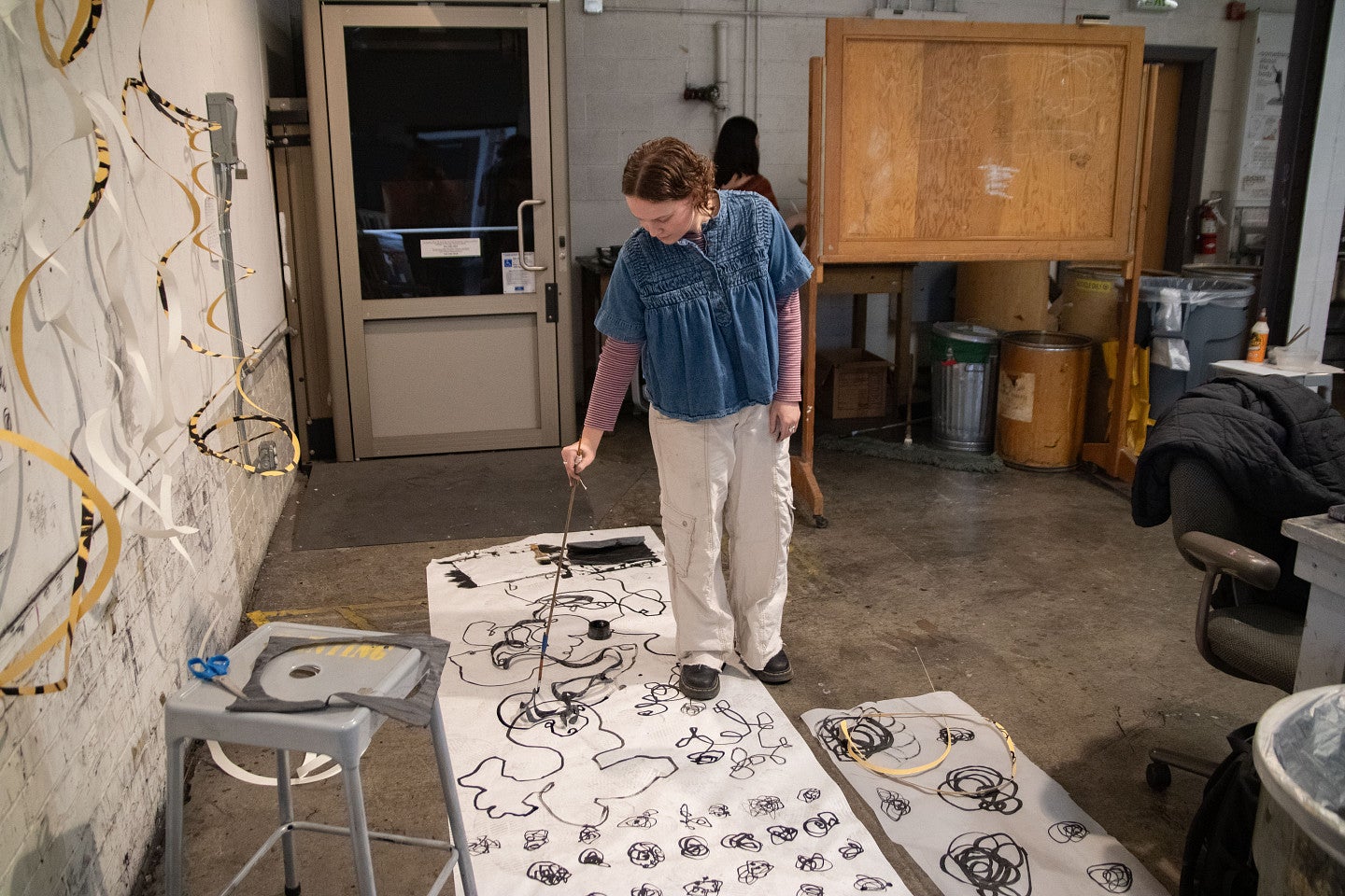 Student paints in a studio. Decorative. 