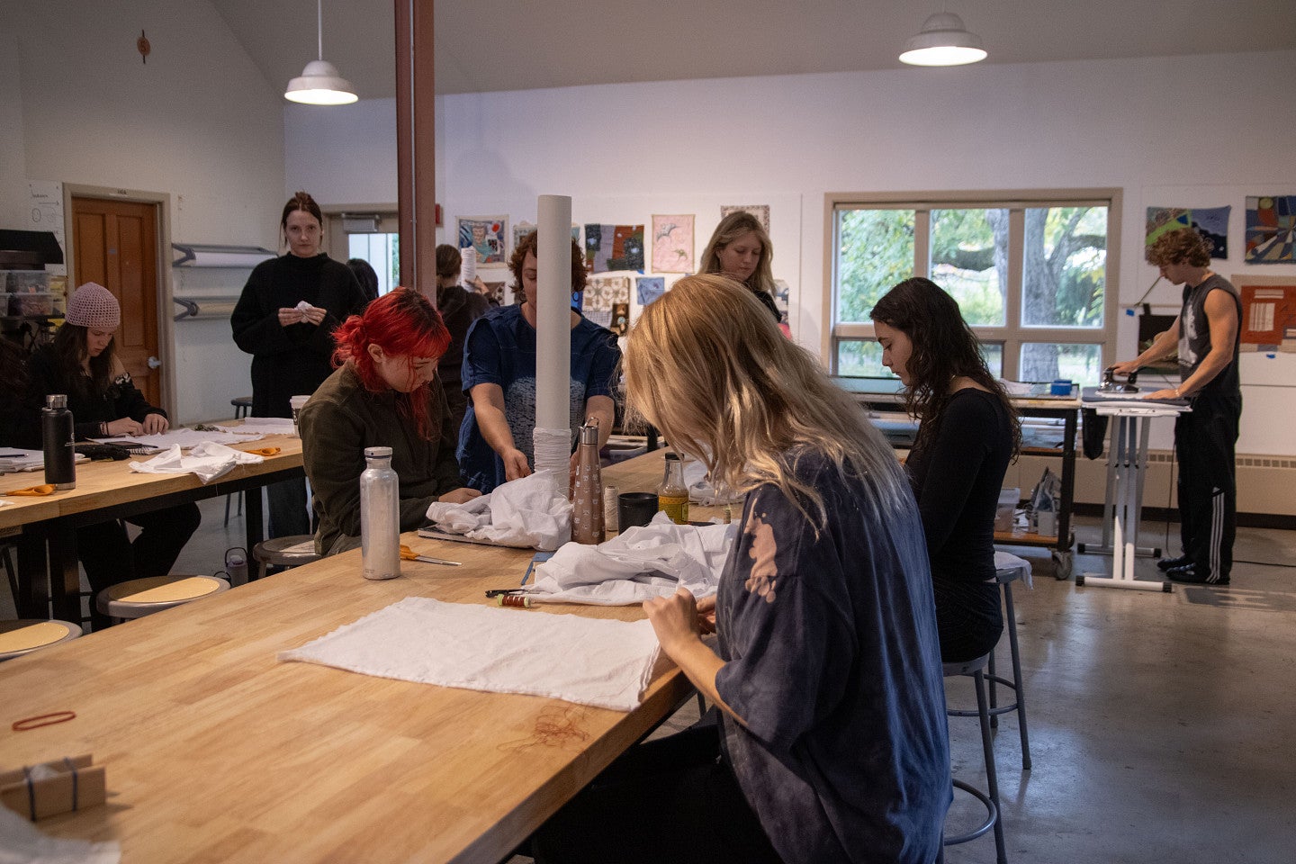 Students work in fibers studio. Decorative. 