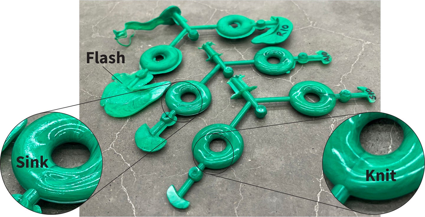 Photo shows testing the part quality from injection molds made with SLA 3D printed acrylic resin injection molds compared to stainless steel and aluminum molds. 