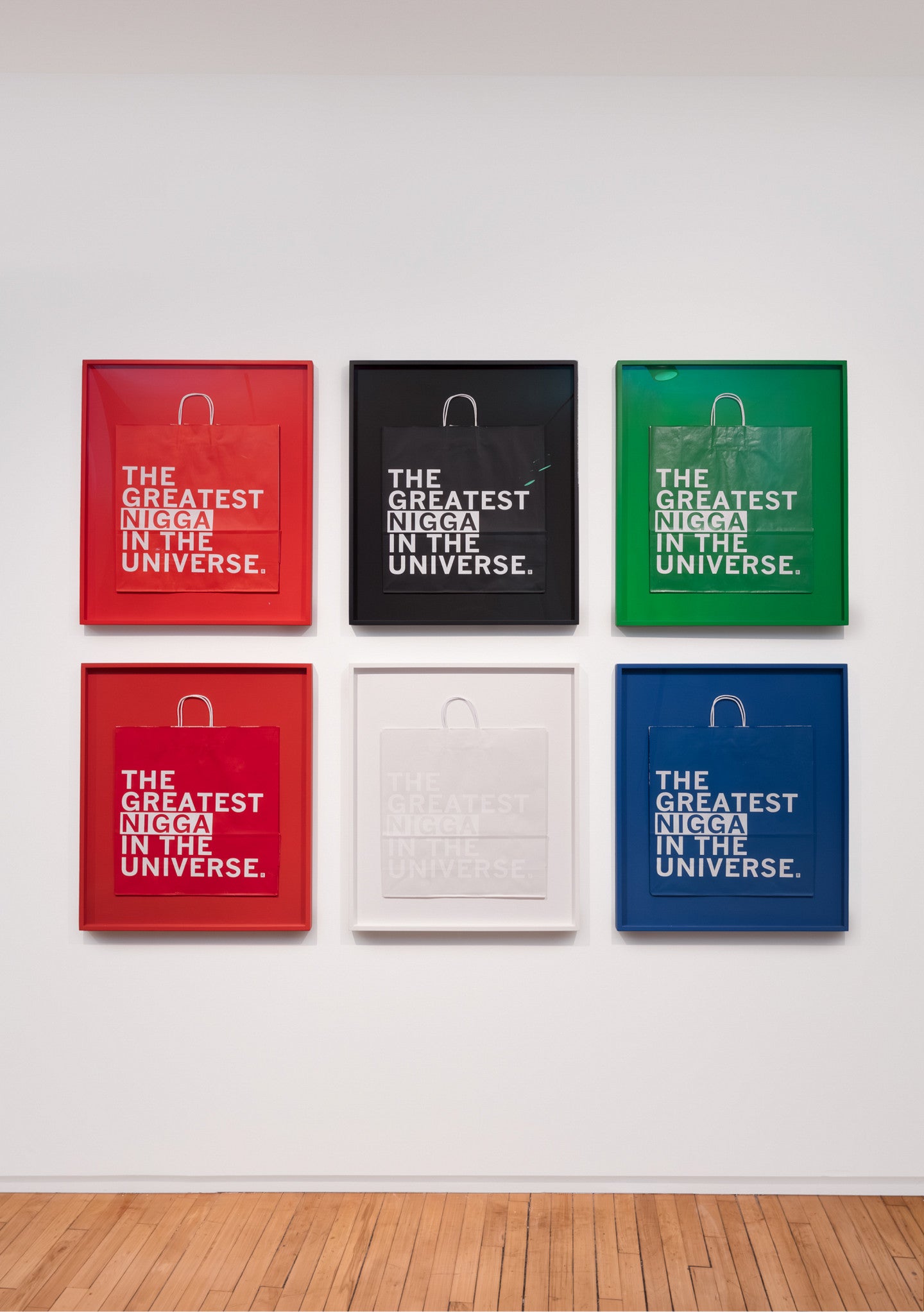 Photograph of the work "Feelin' Myself" and shows six identical two color prints on shopping bags. 