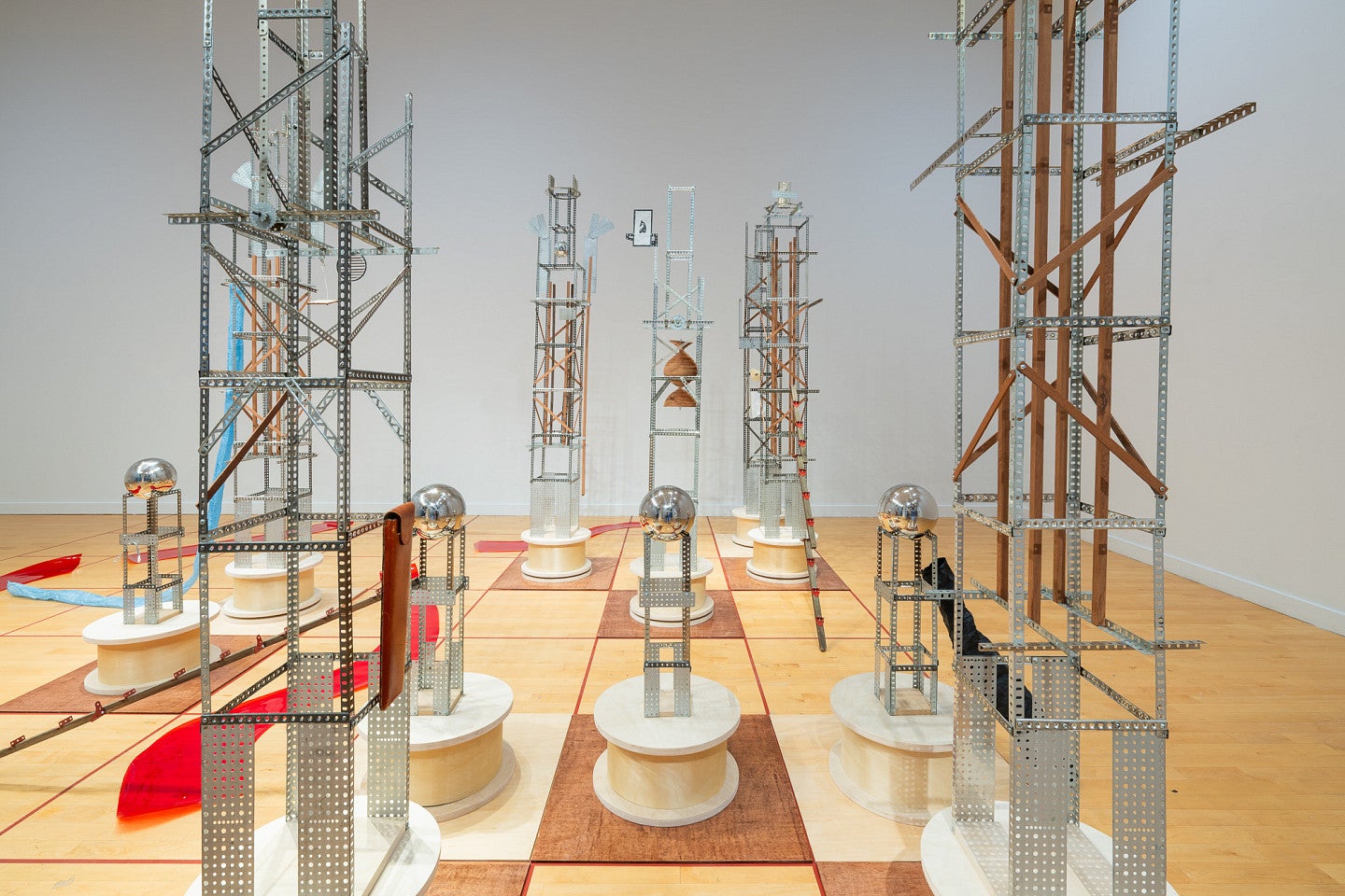 Ido Radon art exhibit shows a collection of items in a gallery space. 