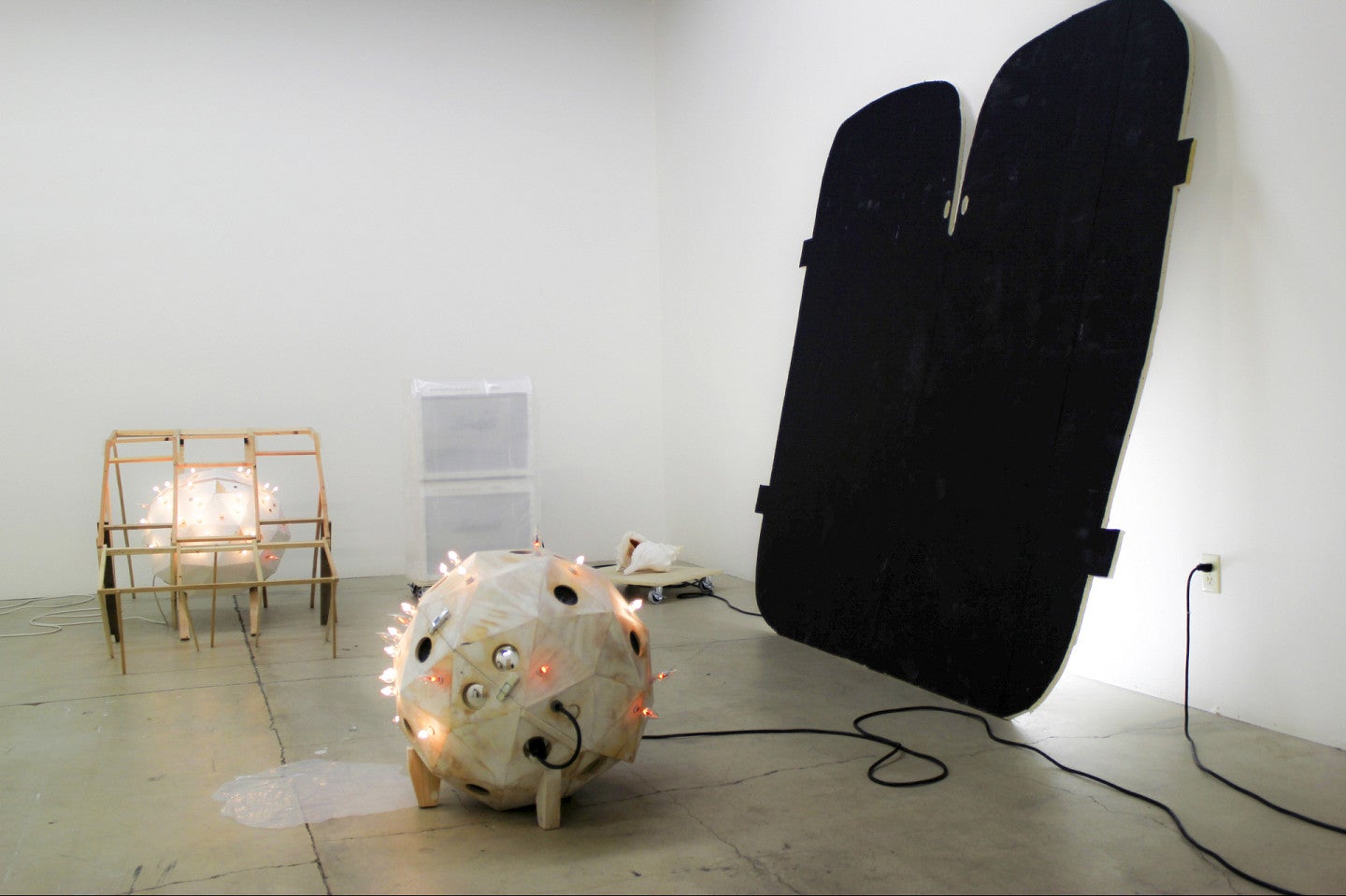 Photograph of Jack's studio. Shows several pieces in various stages of creation. 