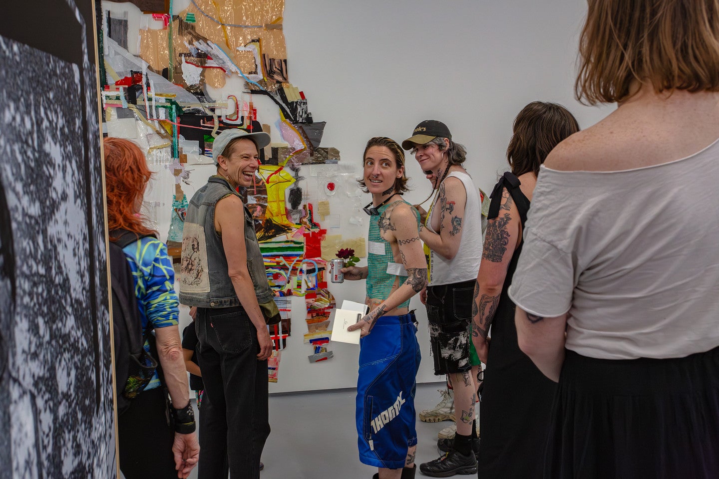 Elri talks with MFA exhibition attendees. 