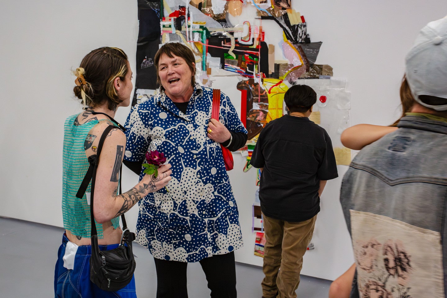 Elri talks to then A+D school director Laura Vandenburgh in front of Elri's MFA exhibition. 