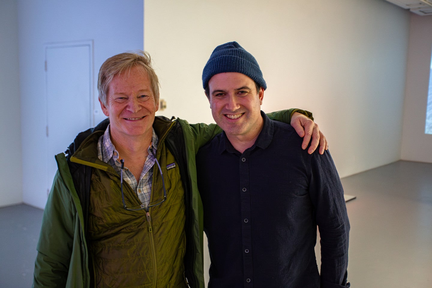 Reza poses with Colin Ives after his lecture in the LaVerne Krause Gallery in Lawrence Hall.