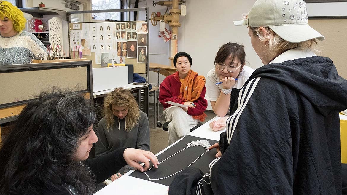 faculty member working with students