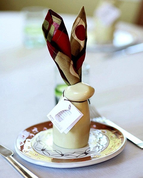 ceramic rabbit on plate with cloth napkin ears