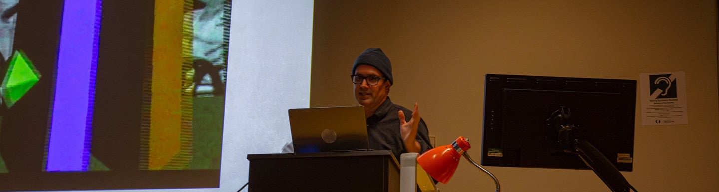 Reza Safavi talks to a packed room for his Visiting Artist Lecture in 2026. 