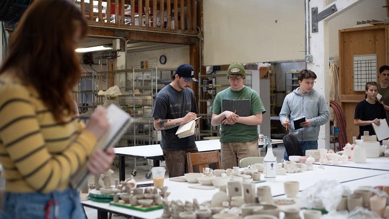 students in ceramic studio