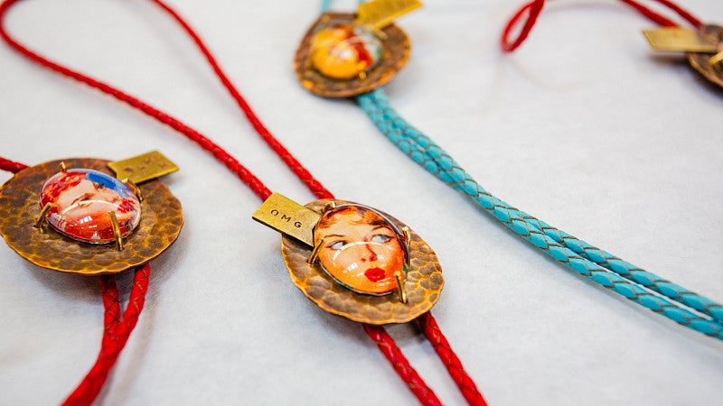 Photograph of three necklaces.