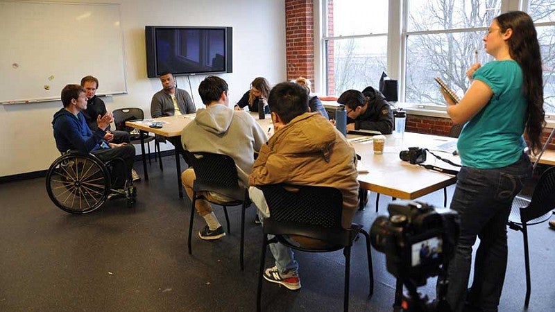 Seth McBride explains to Product Design students in the Adaptive Products course the importance of gloves for the sport of professional, Olympic-calibre wheelchair rugby.