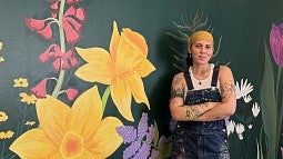 News header image of mural artist. 